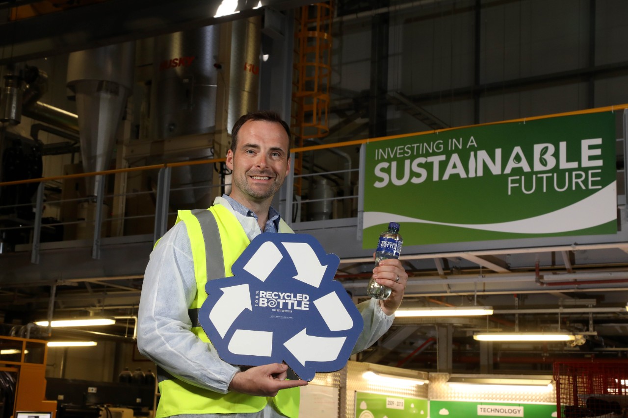 24 May 2019, Mandatory Credit Â©Press Eye/Darren Kidd NEWS RELEASEDEEP RIVERROCK LAUNCHES ITS FIRST 100% RECYCLED BOTTLE Pictured: Mark Haughey, Coca-Cola HBC Plant Manager pictured at the launch of Deep RiverRockâ  s 100% Recycled Bottle range at the Coca-Cola HBC Ireland and Northern Ireland Knockmore Hill Plant in Lisburn, Co. Antrim.DEEP RIVERROCK LAUNCHES ITS FIRST 100% RECYCLED BOTTLE NORTHERN IRELAND ENVIRONMENT AGENCY WELCOMES THE MOVE FROM DEEP RIVERROCK; THE FIRST MAJOR WATER BRAND IN THE REGION TO MOVE TO 100% RECYCLED PETProud Northern Irish water brand, Deep RiverRock announced today that every bottle within its PET portfolio will be made from 100% recycled PET plastic from June 2019. The move sees Deep RiverRock become the first major water brand distributing across the island of Ireland to produce a 100% recycled bottle. As all Deep RiverRock bottles are already 100% recyclable, this new development truly supports the brandâ  s commitment to protecting the environment and to play a value-adding role in communities.Deep RiverRockâ  s investment in recycled PET supports a circular economy, keeping resources in use for as long as possible. Recycled PET bottles are also one of the lowest carbon-dense packaging types to produce within the beverage sector.When recycled correctly, PET bottles can, and should, have a longer life span and Deep RiverRock is committed to encouraging consumers to recycle all PET bottles. In a bold statement, Deep RiverRock will â  recycleâ   its logo on all bottles with an impactful â  100% Recycled Bottleâ   message front-of-pack. The move aims to inspire more responsible disposal of waste and greater recycling among consumers. It is supported by recycling messages which have already been integrated on the bottle cap and across its TV advertising. ENDSTo find out more about Coca-Cola HBC Ireland and Northern Irelandâ  s wider sustainability strategy, in partnership with The Coca-Cola Company, visit ie.coca-